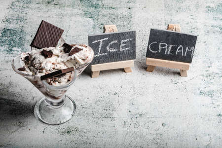 Speciality Italian stracciatella ice cream scoop with flakes of dark chocolate in a creamy vanilla ice-cream. Top view. Speciality Italian stracciatella iceの写真素材