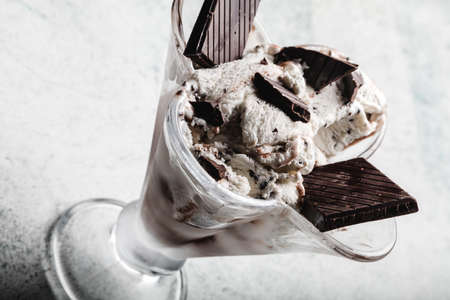 Speciality Italian stracciatella ice cream scoop with flakes of dark chocolate in a creamy vanilla ice-cream. Top view. Speciality Italian stracciatella iceの写真素材