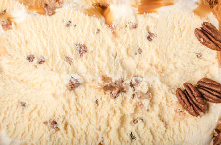 ice cream with ground nuts on white concrete tableの写真素材