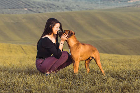 fashion girl at the brown meadow in fallの写真素材