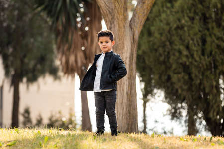 Boy posing in the park. Different expressionsの写真素材