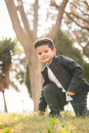 Boy posing in the park. Different expressionsの写真素材