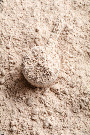 Scoop of Whey Protein in background. Sport nutrition.の写真素材