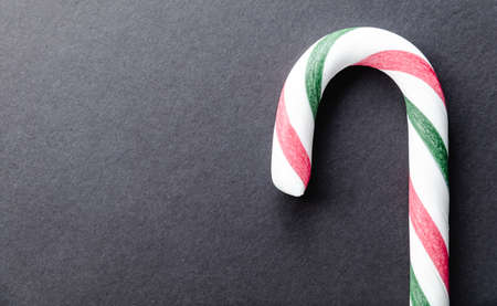 Christmas cane candy on black backgroundの写真素材