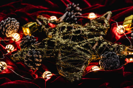 Christmas decoration, star and lights on red velvetの写真素材