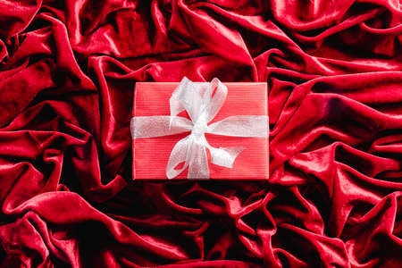 Gift on red velvet background. Christmas decorationの写真素材
