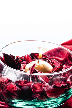dissected rose petals on red velvetの写真素材