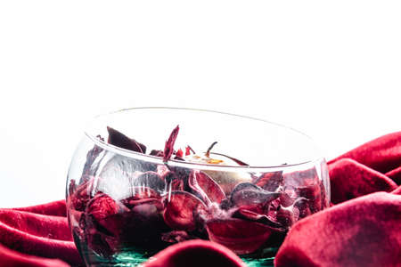 dissected rose petals on red velvetの写真素材