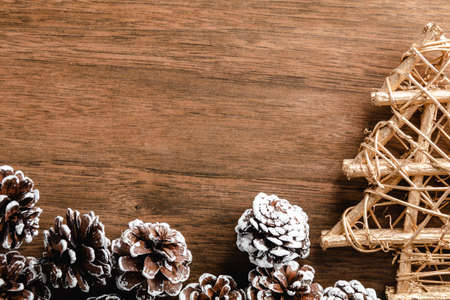 Pine cones on wood background. Christmas decoration with copy spaceの写真素材