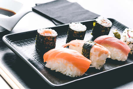 varied sushi plate on wood tableの写真素材
