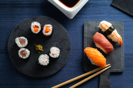 varied sushi plate on wood tableの写真素材