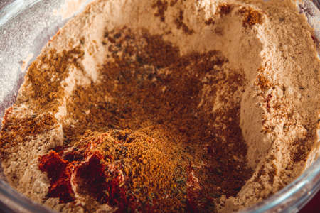 Man doing the seitan cooking process at home. How to prepare seitan at home vegan meatの写真素材