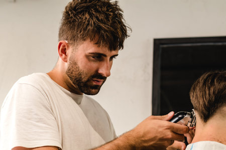 Concentrated Barber Making Perfect Haircut