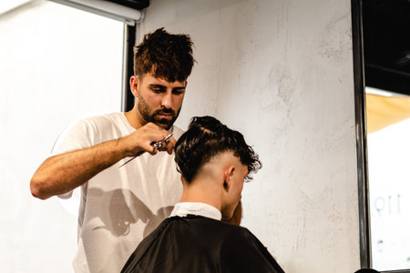 Men Hair Salon. Barber Doing Haircut In Barbershop. Young Male Client And Hairdresser.