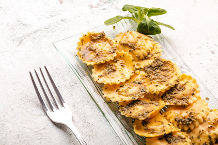 Italian stuffed pasta ravioli with pesto sauceの写真素材