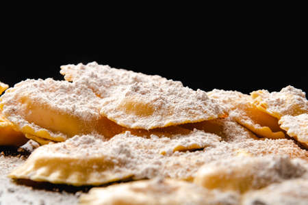 Cooking italian ravioli on wooden table. Top View with Copy Space.の写真素材