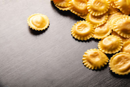 Cooking italian ravioli on wooden table. Top View with Copy Space.の写真素材