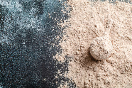 Top view whey protein scoop on dark background, copy spaceの写真素材