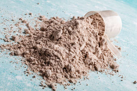 Scoop of Whey Protein in background. Sport nutrition.の写真素材