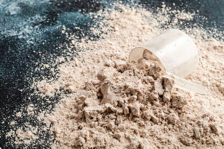 Scoop of Whey Protein in background. Sport nutrition.の写真素材