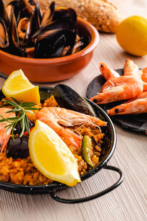Paella traditional Spanish food, served on tapa plateの写真素材