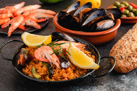 Paella traditional Spanish food, served on tapa plateの写真素材