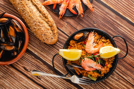 Paella traditional Spanish food, served on tapa plateの写真素材