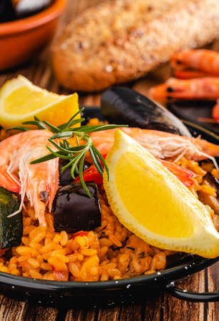 Paella traditional Spanish food, served on tapa plateの写真素材