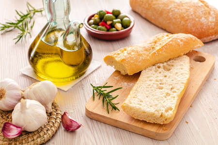 rustic bread and olive oil ready to make toastsの写真素材