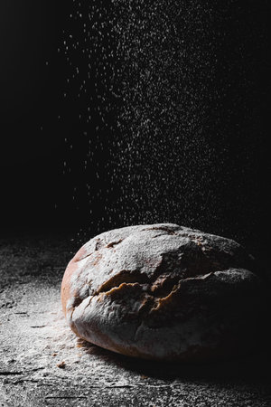 dark homemade bread dusted with flour