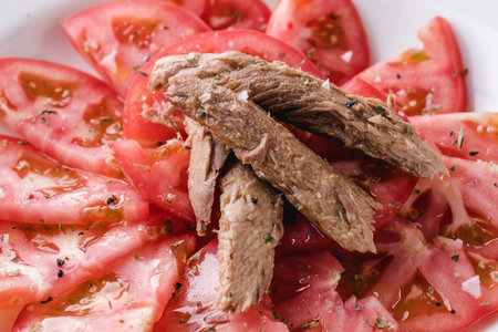 Seasoned tomato with melva ready to eat. Spanish restaurant dish