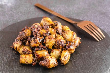 Salted baby artichokes with Pedro Ximenez reductionの写真素材