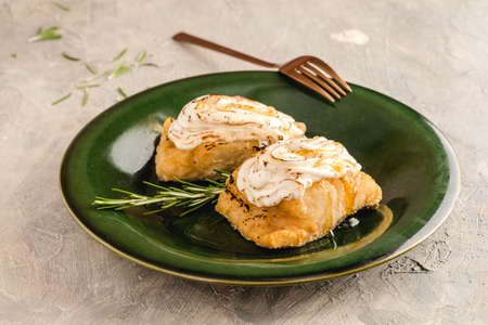 Cod medallions au gratin with aioli and rosemary honeyの写真素材