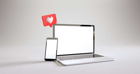 Mobile phone and laptop mockup with a like notifications at white background. 3d renderingの写真素材