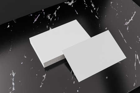 3D Illustration. Two white business cards mockup on black marble. Template for branding design. Business concept.の写真素材