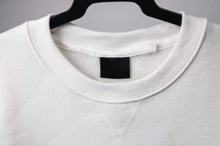 Empty black label on white sweatshirt for logo, size and info.の写真素材