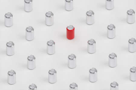 Set of many blank aluminum cans and a red can. 3d renderの写真素材