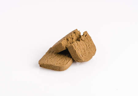 Two marijuana cannabis pollen hashish on a white background.の写真素材
