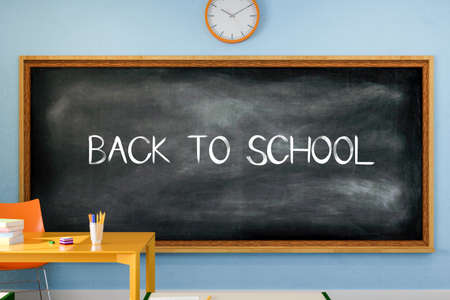 3D illustration. Back to school text written on a blackboard in the classroom.の写真素材
