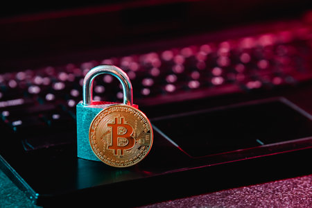 Bitcoin and padlock on laptopの写真素材