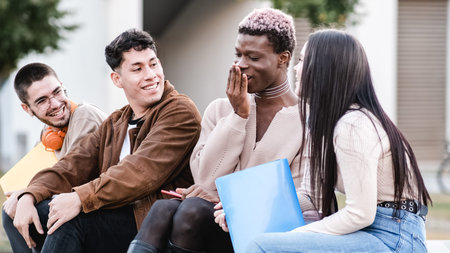 Happy transgender student speaking with friends