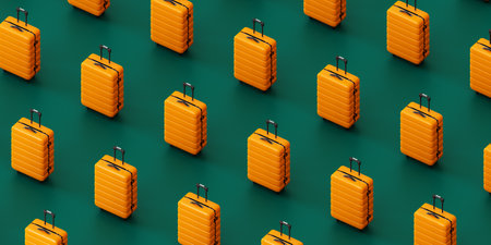 Similar yellow suitcases against green backgroundの写真素材