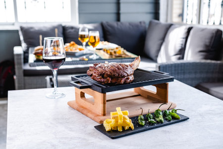 Grilled meat served with wine in barの写真素材
