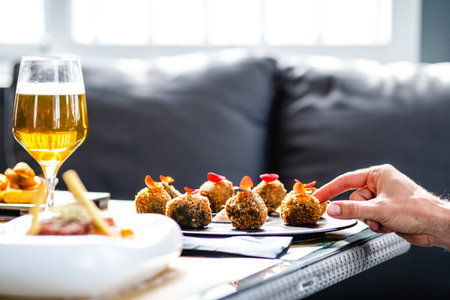 Crop person eating delicious appetizerの写真素材