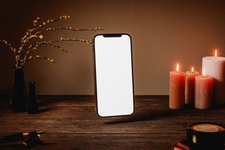 3D rendering of modern smartphone with blank screen placed on wooden tableの写真素材