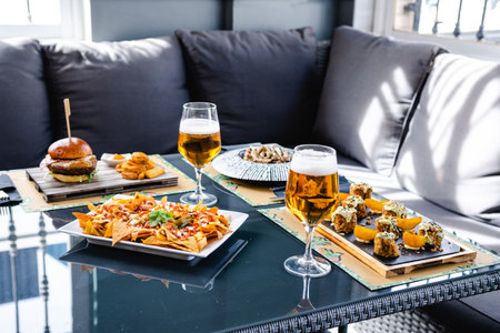 Delicious food and beer on tableの写真素材