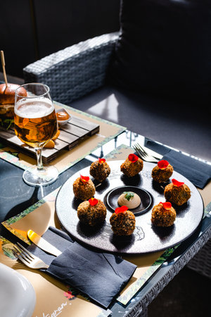 Delicious appetizer with beer on tableの写真素材