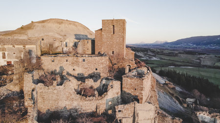 Rocky formations in mountainous terrain on sunset. Embalse de Yesa, Spainの写真素材