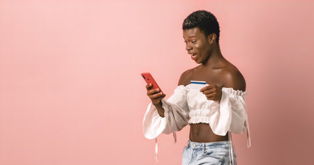 Excited transgender person spending money during online shoppingの写真素材