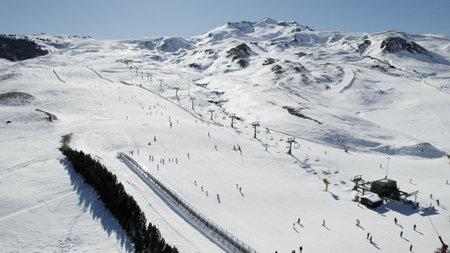 People skiing on the ski slope in winter, aerial view. Portalet Formigal, Spainの写真素材